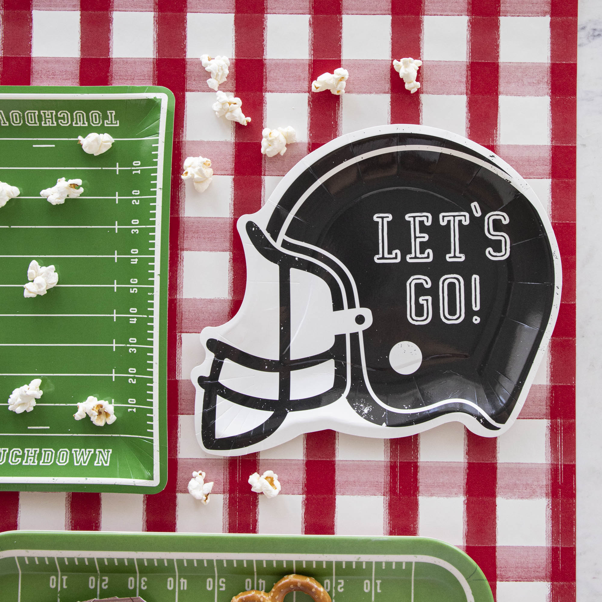 Football helmet paper plates with the words &quot;LET&