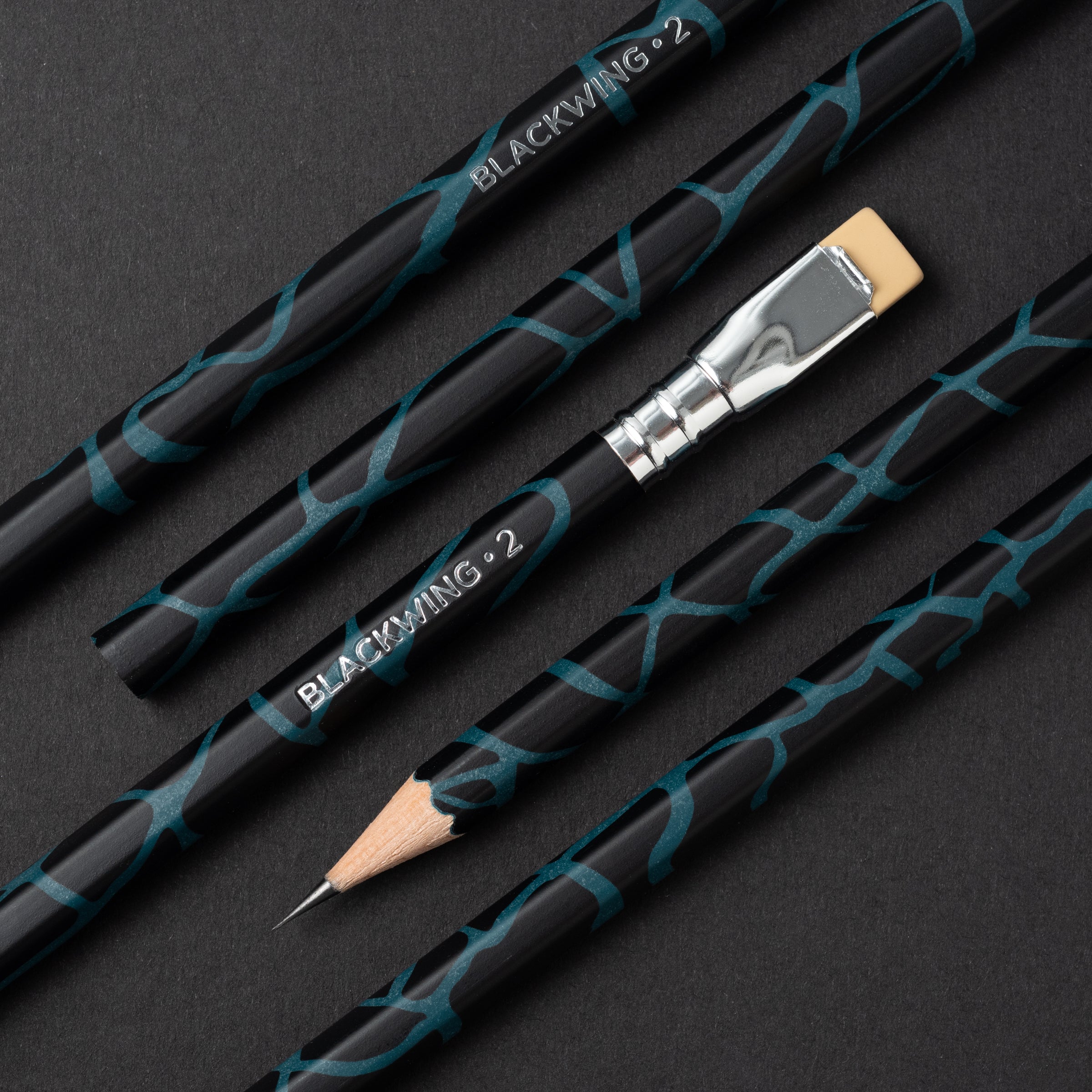 A set of Blackwing Volume 2 - The Light &amp; Dark Pencils on a black surface, reflecting the cultural shift of 1973.