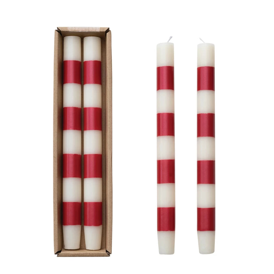 Set of 2 red &amp; white striped taper candles in a box and out of the box.