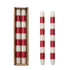 Set of 2 red & white striped taper candles in a box and out of the box.