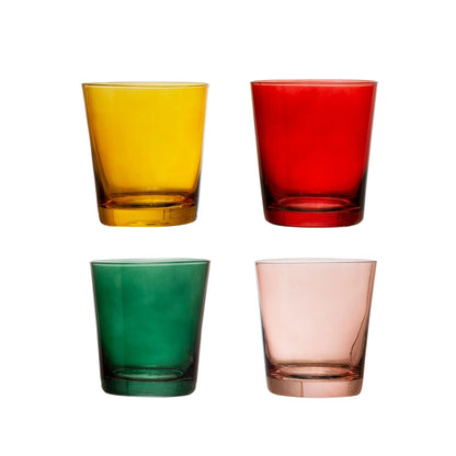 Three colorful Creative Co-Op lowball glasses in green, yellow, and red, with a pink glass stacked on top.