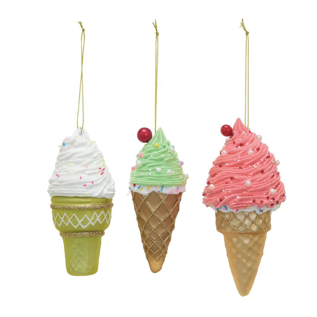 Three decorative Ice Cream Ornaments adorned with white, green or pink icing, sprinkles, a cherry and glitter, on a white background.