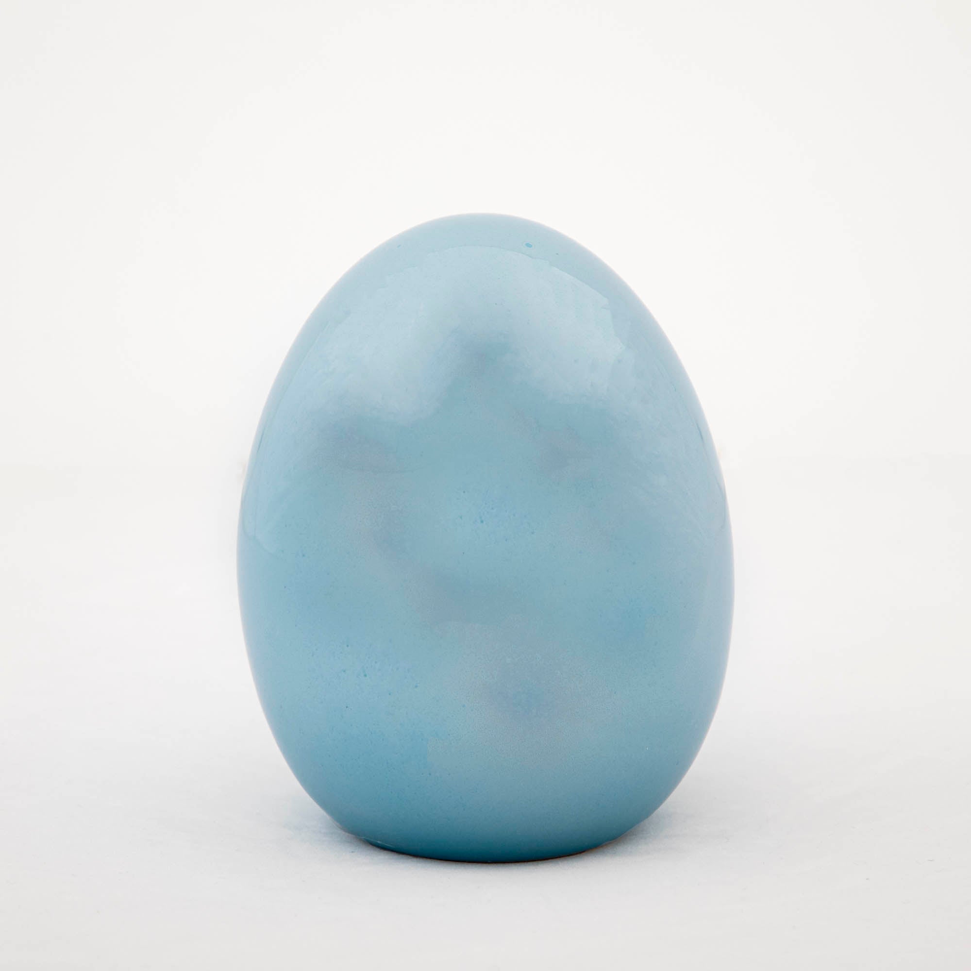 A Glitterville iridescent blue Large Iridescent Egg on a white background, perfect for Easter decorations.