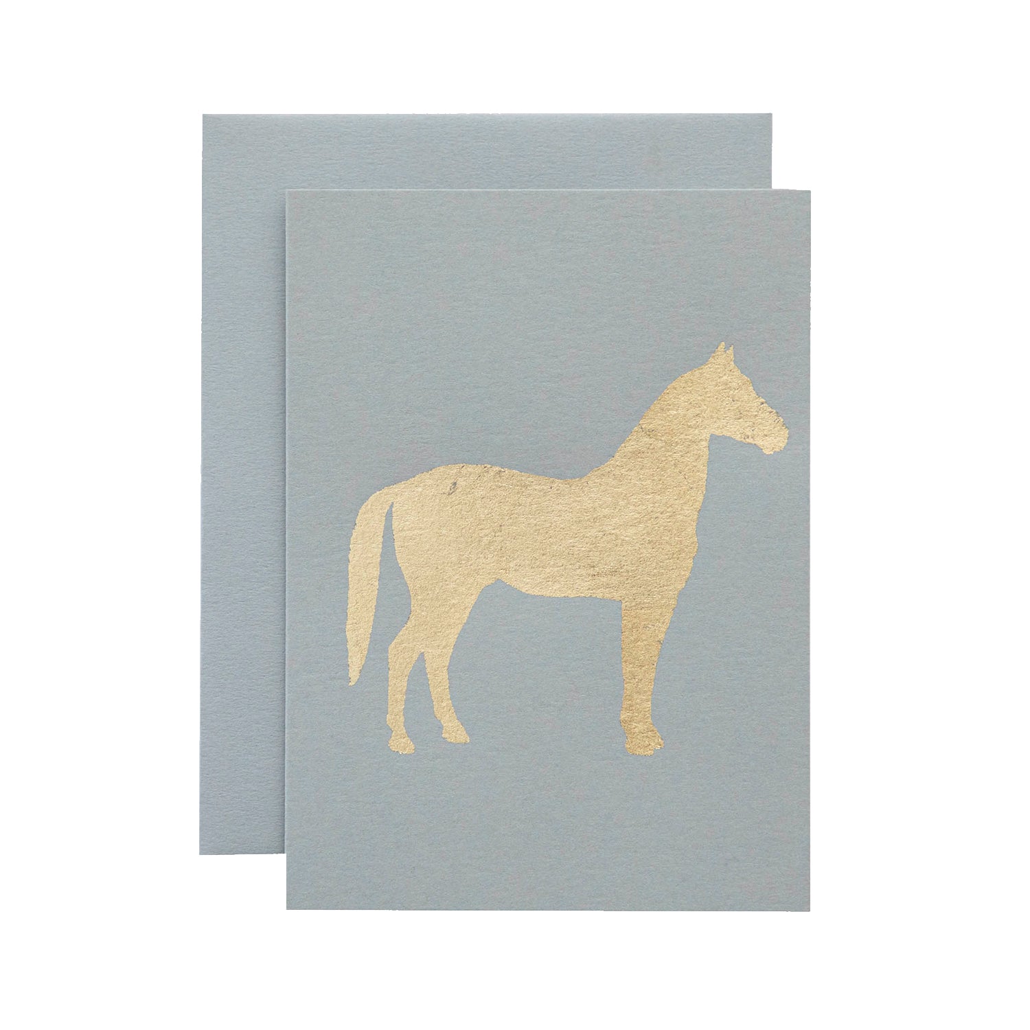 A light gray card with the silhouette of a horse in solid gold leaf.