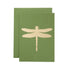 A leaf-green card with the silhouette of a dragonfly in solid gold leaf.