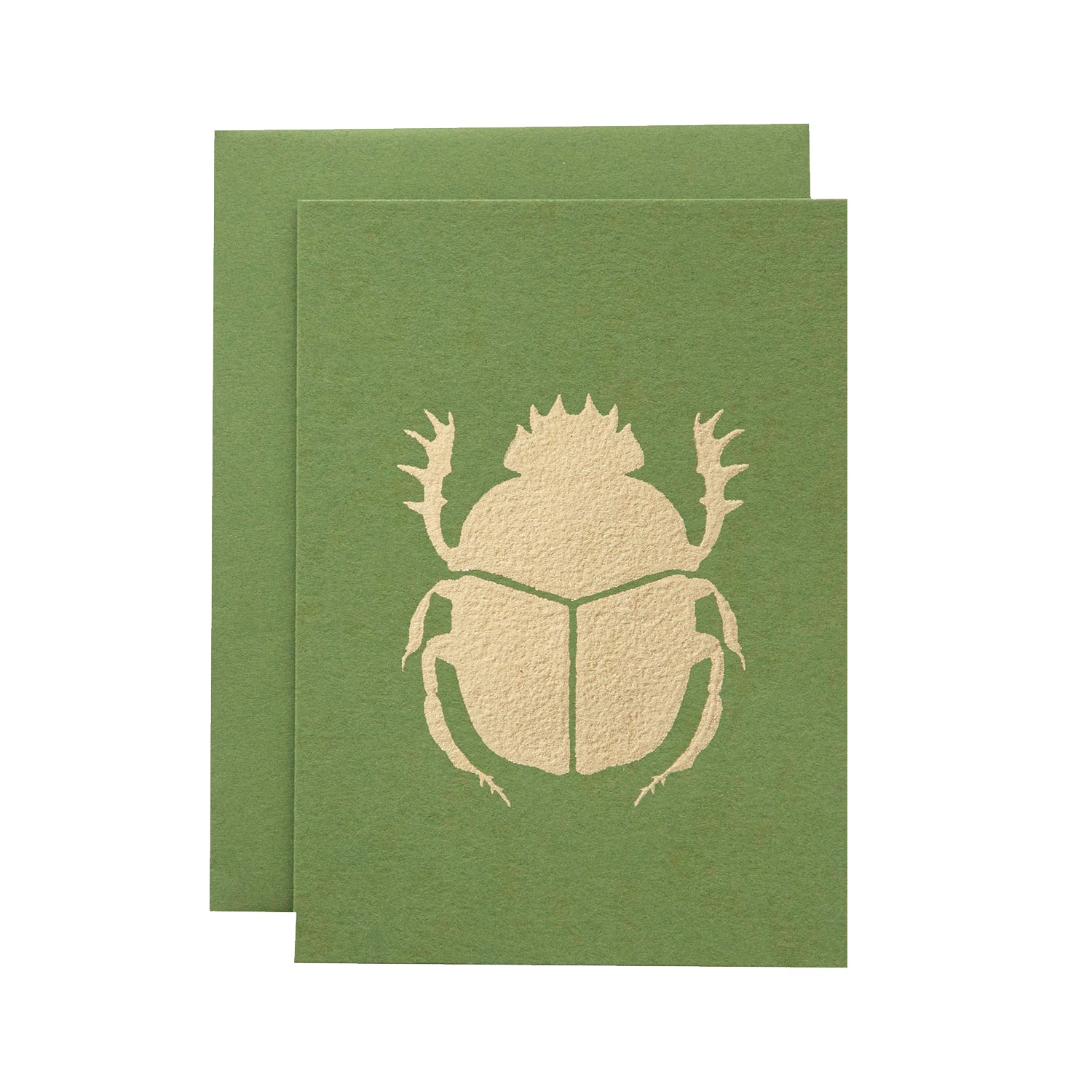 A leaf-green card with the silhouette of a scarab beetle in solid gold leaf.