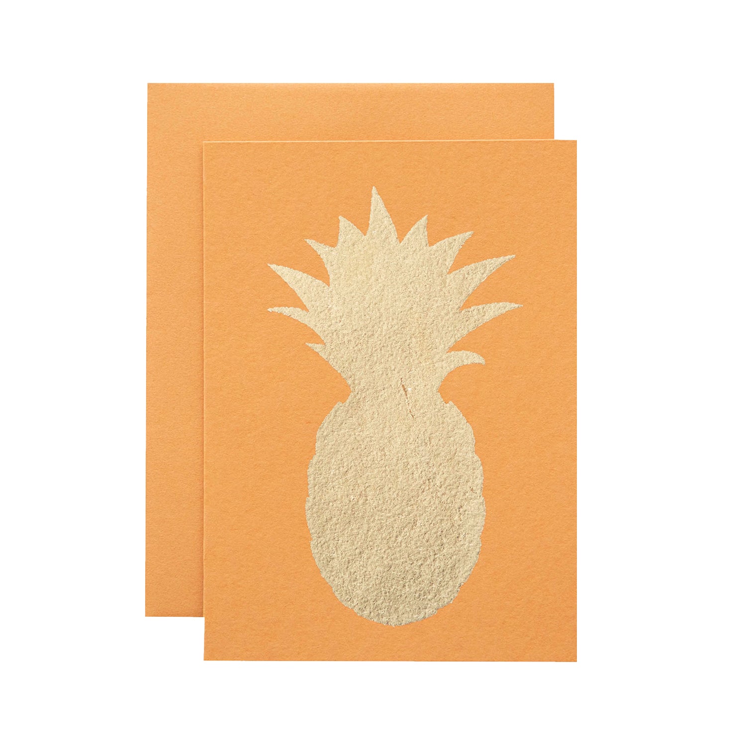 A bright orange card featuring the silhouette of a pineapple in solid gold leaf.