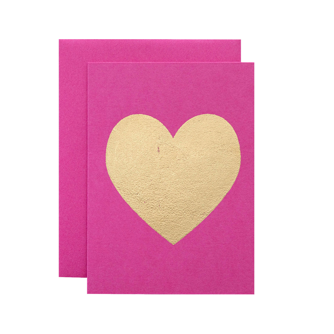 A pink card featuring the silhouette of a heart in solid gold leaf.