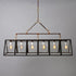 An industrial-style chandelier with five exposed vintage Edison bulbs by Hester & Cook&