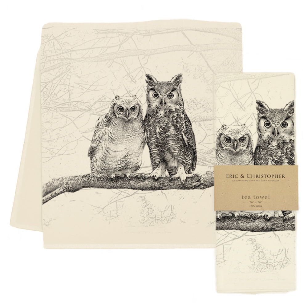 Tea towel printed with image of 2 owls on a tree branch