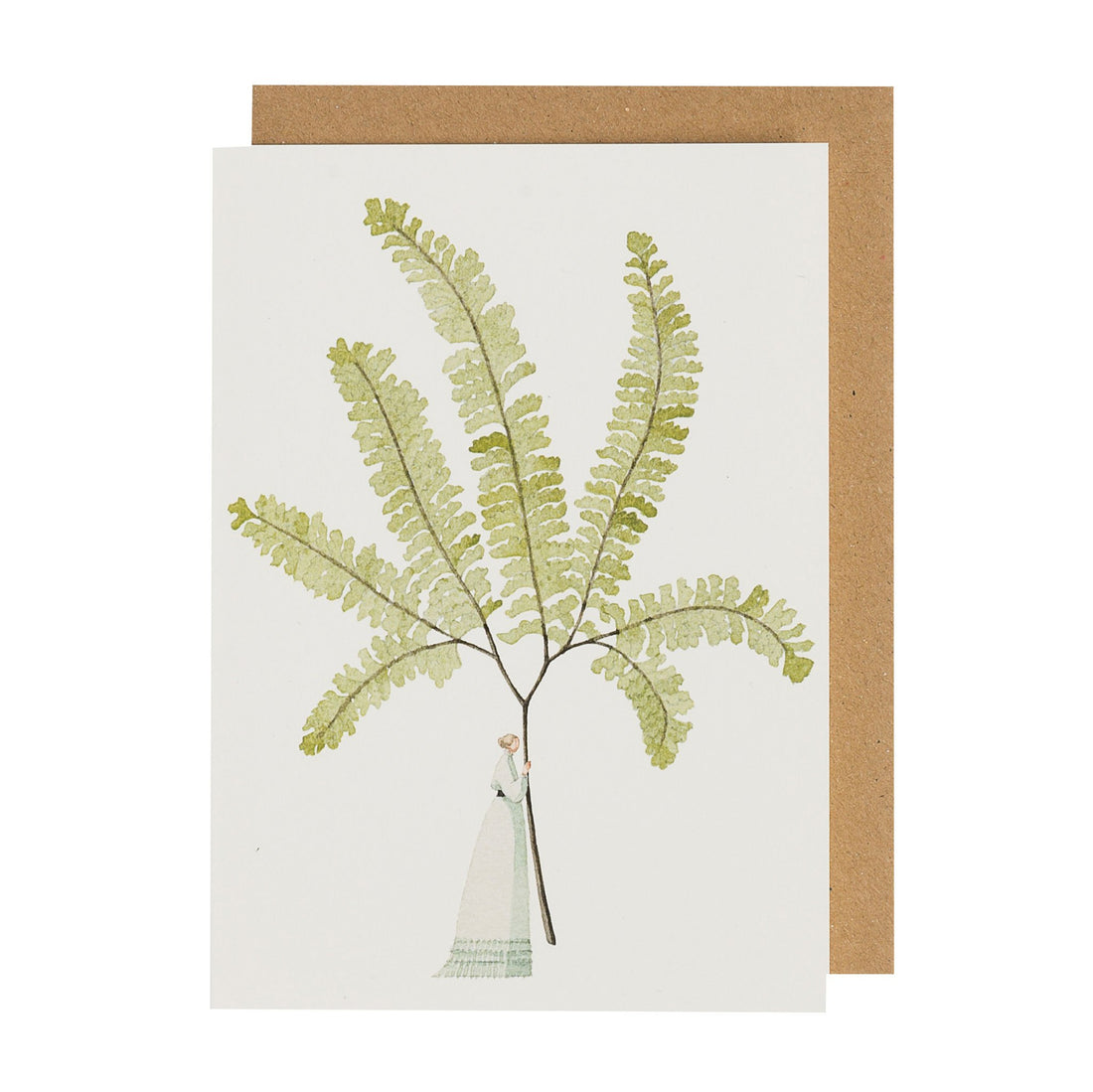 A greeting card featuring a stylized watercolor illustration of a small woman holding a gigantic fern frond by the stem on a white background, with the included kraft paper envelope.