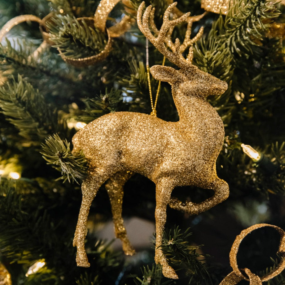 Gold Glittered Deer Ornament in a tree