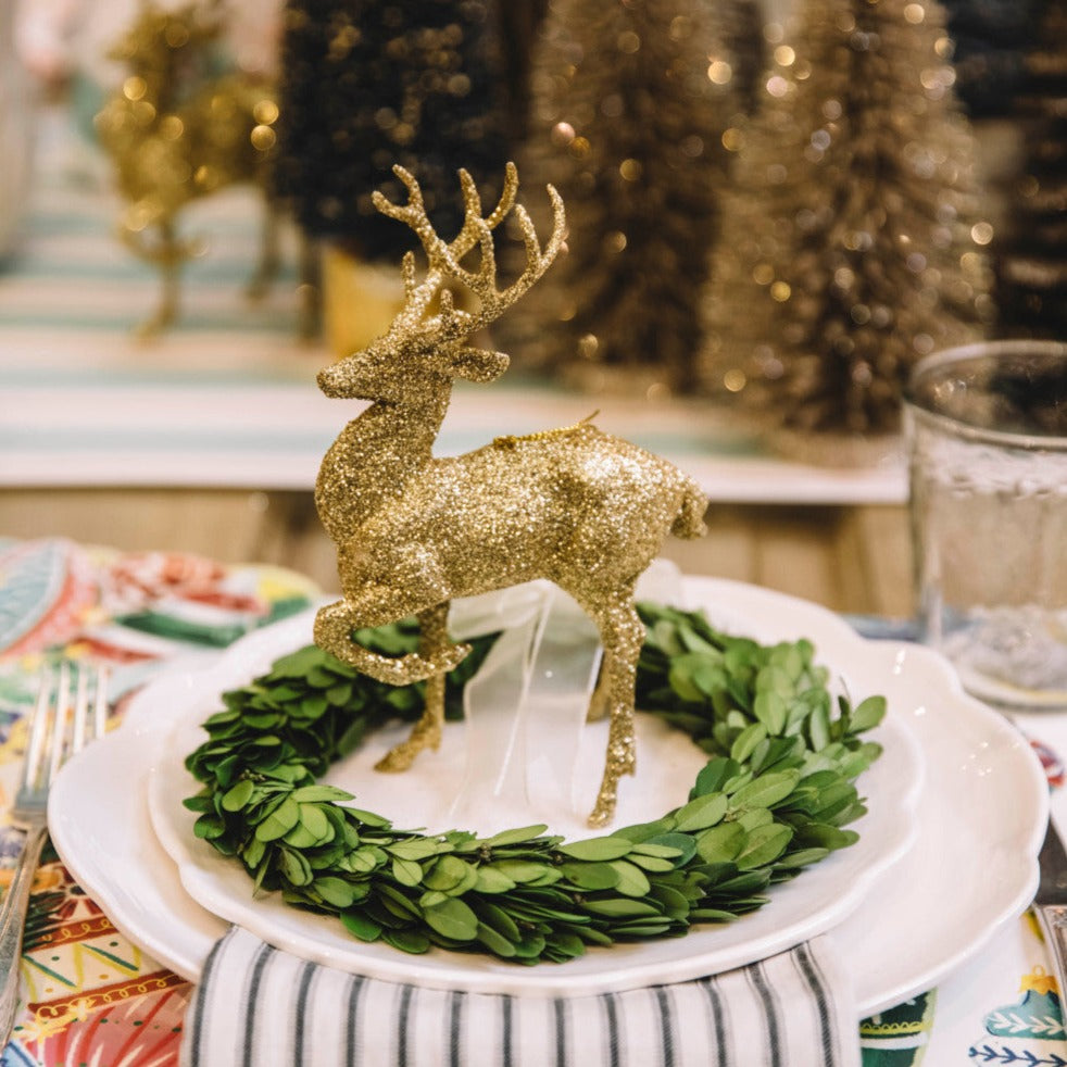 Gold Glittered Deer on a Holiday table 