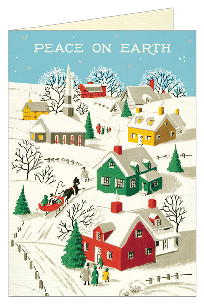 Greeting card saying peace on earth at the top with a snowy town scene 