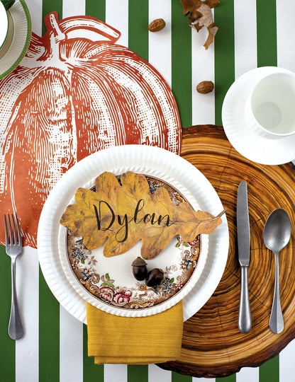 The Die-cut Pumpkin Placemat under an elegant fall-themed place setting, from above.
