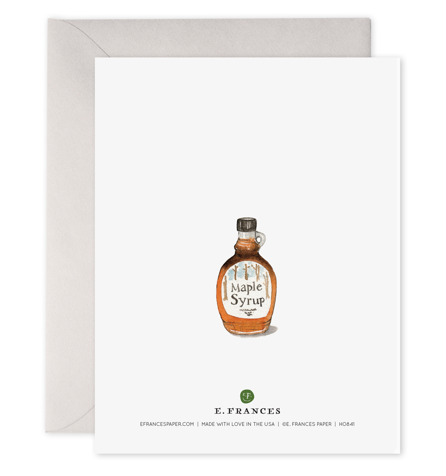 back of card with illustration of a bottle of maple syrup on it. 