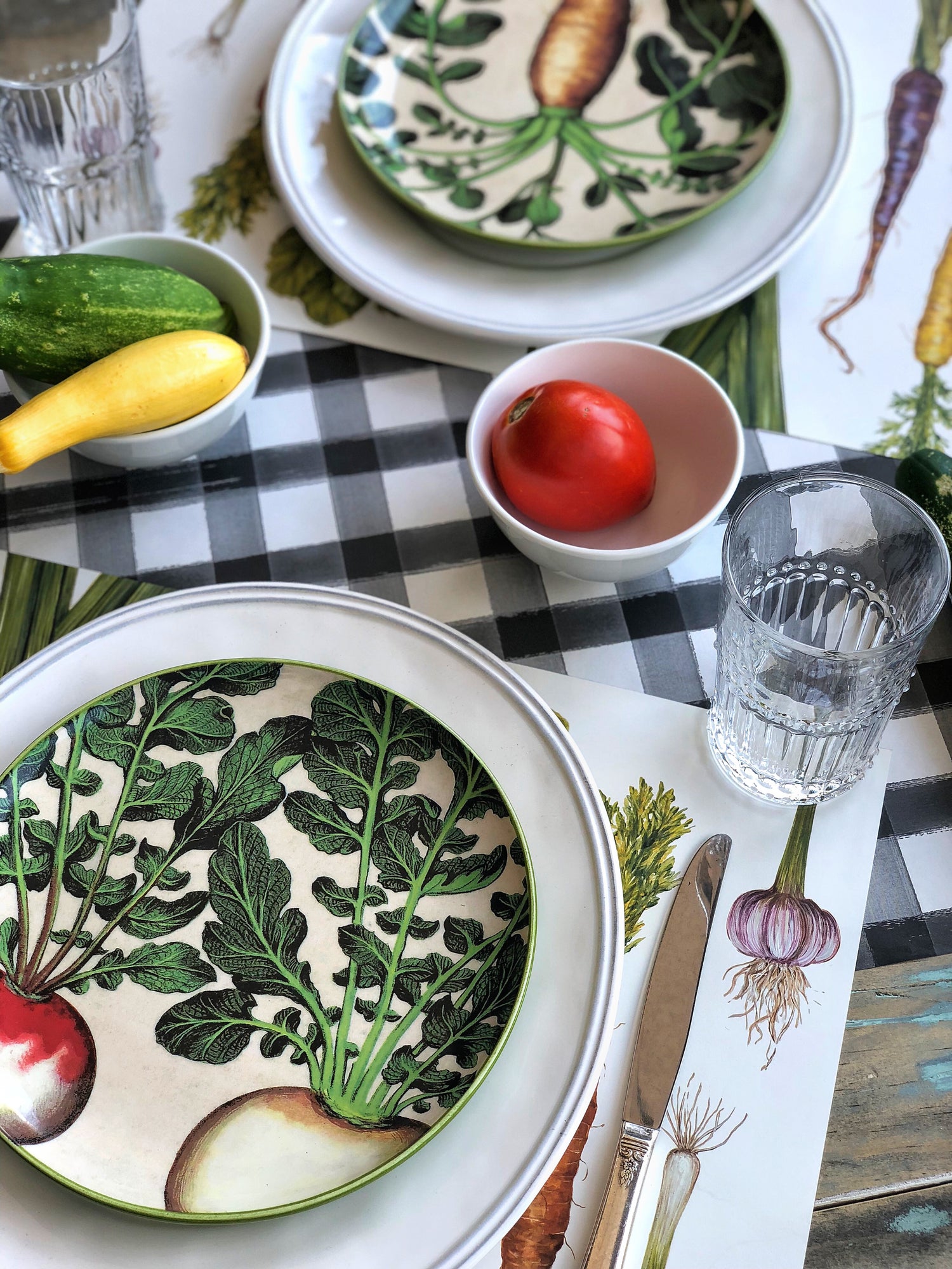 The Black Painted Check Runner under an elegant vegetable-themed table setting.