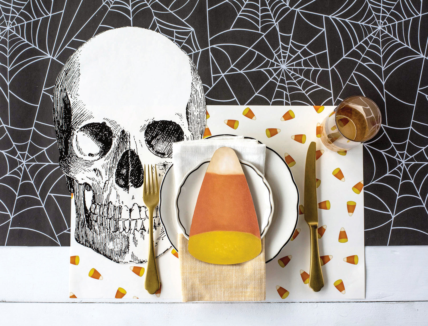 The Spiderweb Runner under a spooky Halloween-themed place setting.