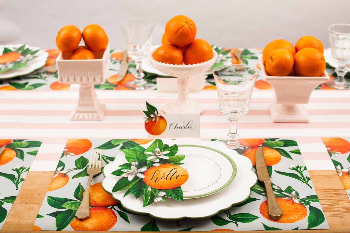 The Pink Classic Stripe Runner under an elegant citrus-themed table setting.