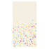 A rectangle, cream guest napkin with a scatter of multicolor confetti dots, concentrated toward the bottom with none at the top.