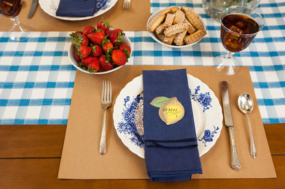A Blue Painted Check Runner under an elegant summertime place setting.