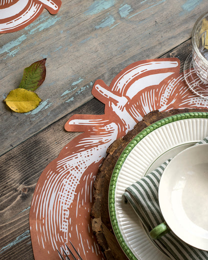 Close-up of the Die-cut Pumpkin Placemat under an elegant fall-themed place setting.