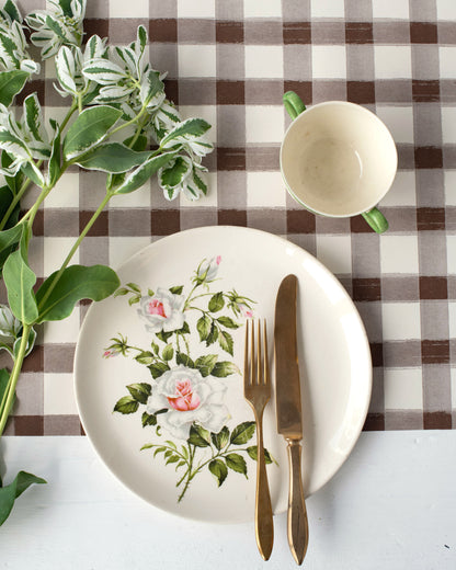 An elegant place setting for tea time featuring the Brown Painted Check Runner.