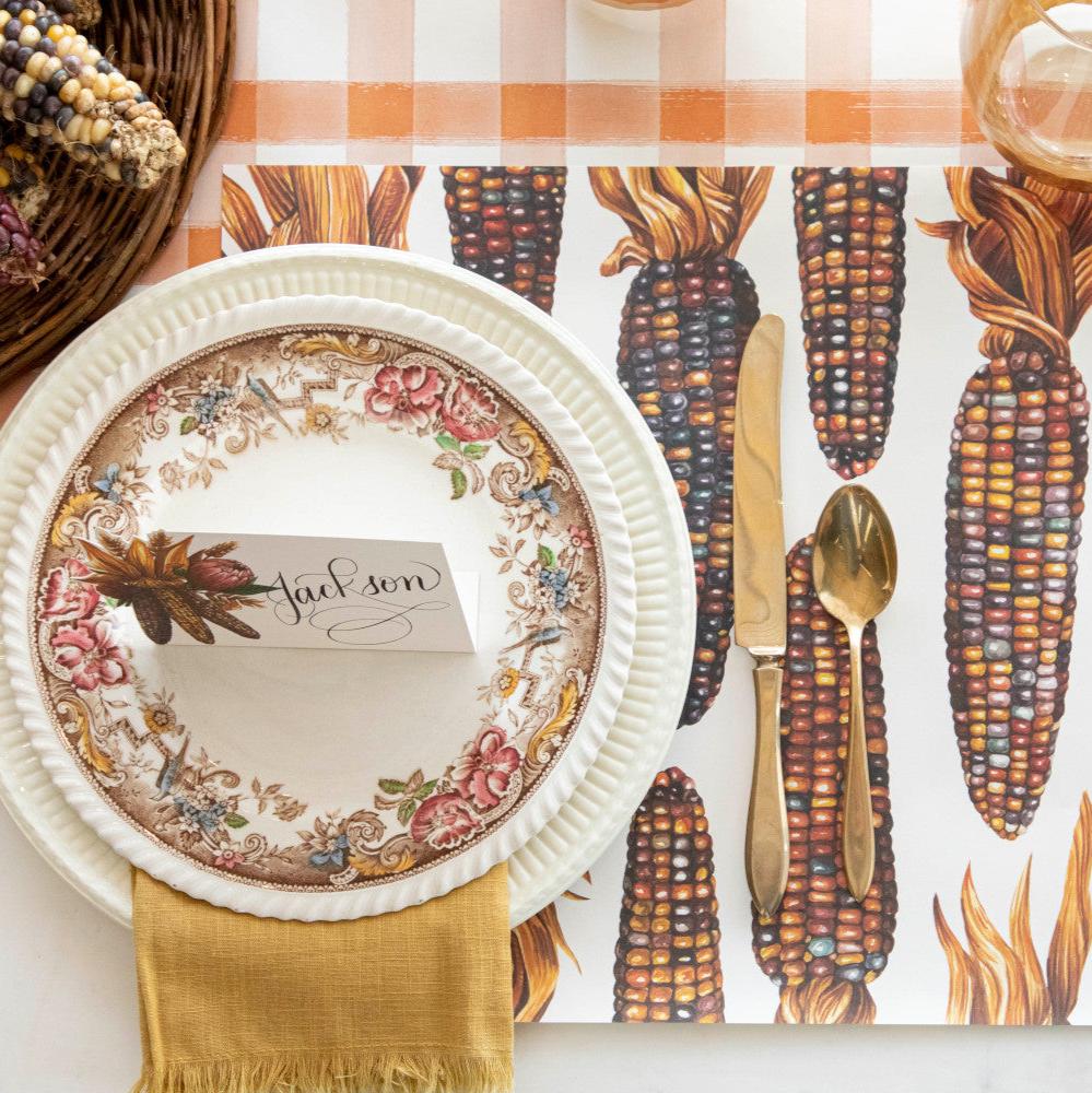 The Gathering Maize Placemat under a fall-themed place setting, from above.