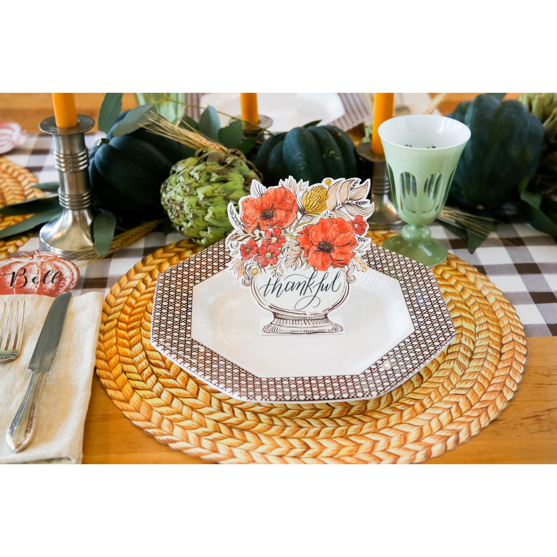 An elegant place setting featuring an Autumn Arrangement Place Card on the plate, with &quot;thankful&quot; written in gorgeous script. 