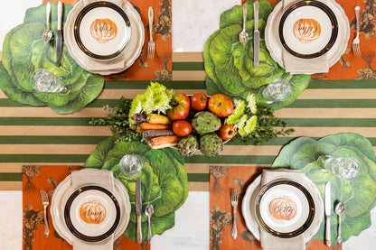 The Kraft Green Classic Stripe Runner under an rustic vegetable-themed table setting for four, from above.