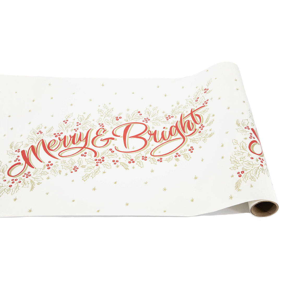 A paper runner roll featuring red and gold calligraphy, &quot;Merry &amp; Bright&quot;, surrounded by gold holly and snowflakes and red berries, repeating on a white background.