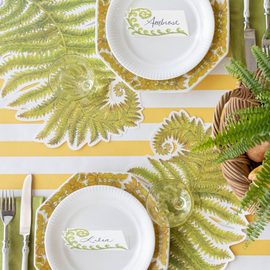 A Marigold Classic Stripe Runner from Hester &amp; Cook under an elegant fern-themed table setting, from above.