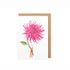 The Pink Dahlia Greeting Card features a stylized illustration of a small man holding a gigantic pink dahlia flower by the stem.