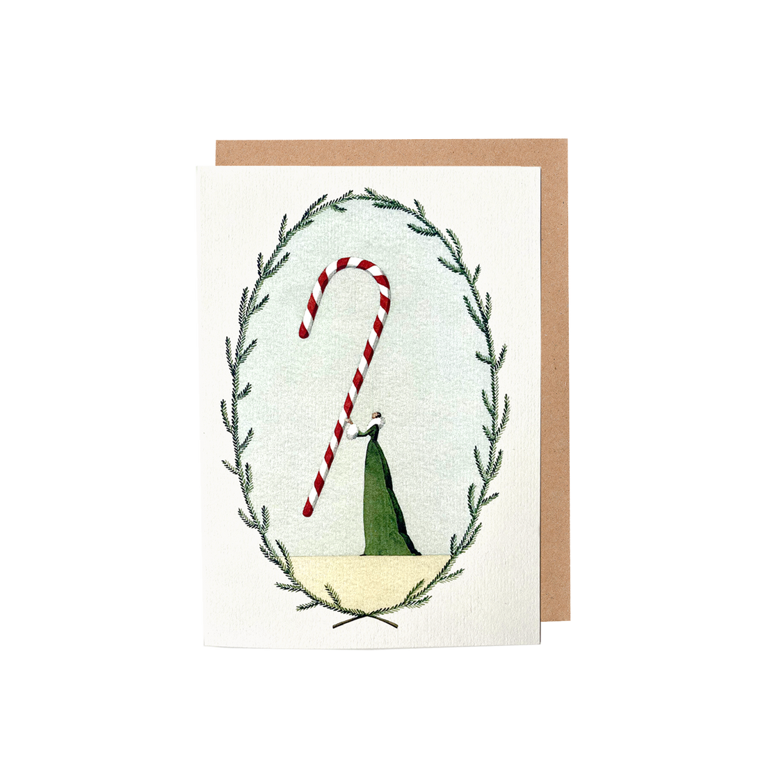 The Candy Cane Greeting Card features an illustration of a woman in a long green dress holding a gigantic red and white candy cane within a frame of green foliage, with a brown kraft paper envelope included.