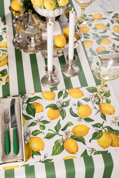 The Lemon Placemat in a bright summer-themed table setting for three, sans plates.