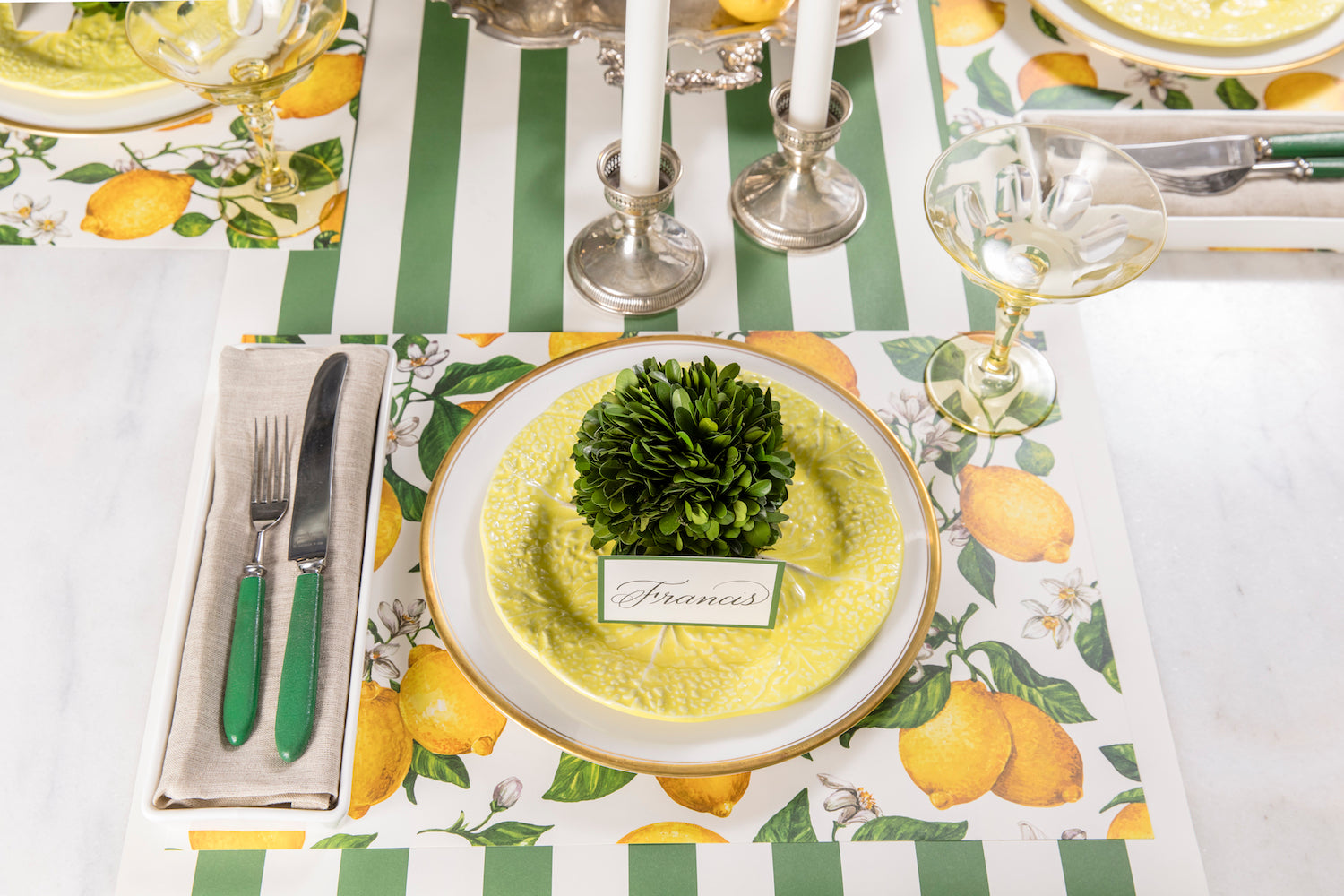 The Lemon Placemat in a bright summer-themed table setting for three.