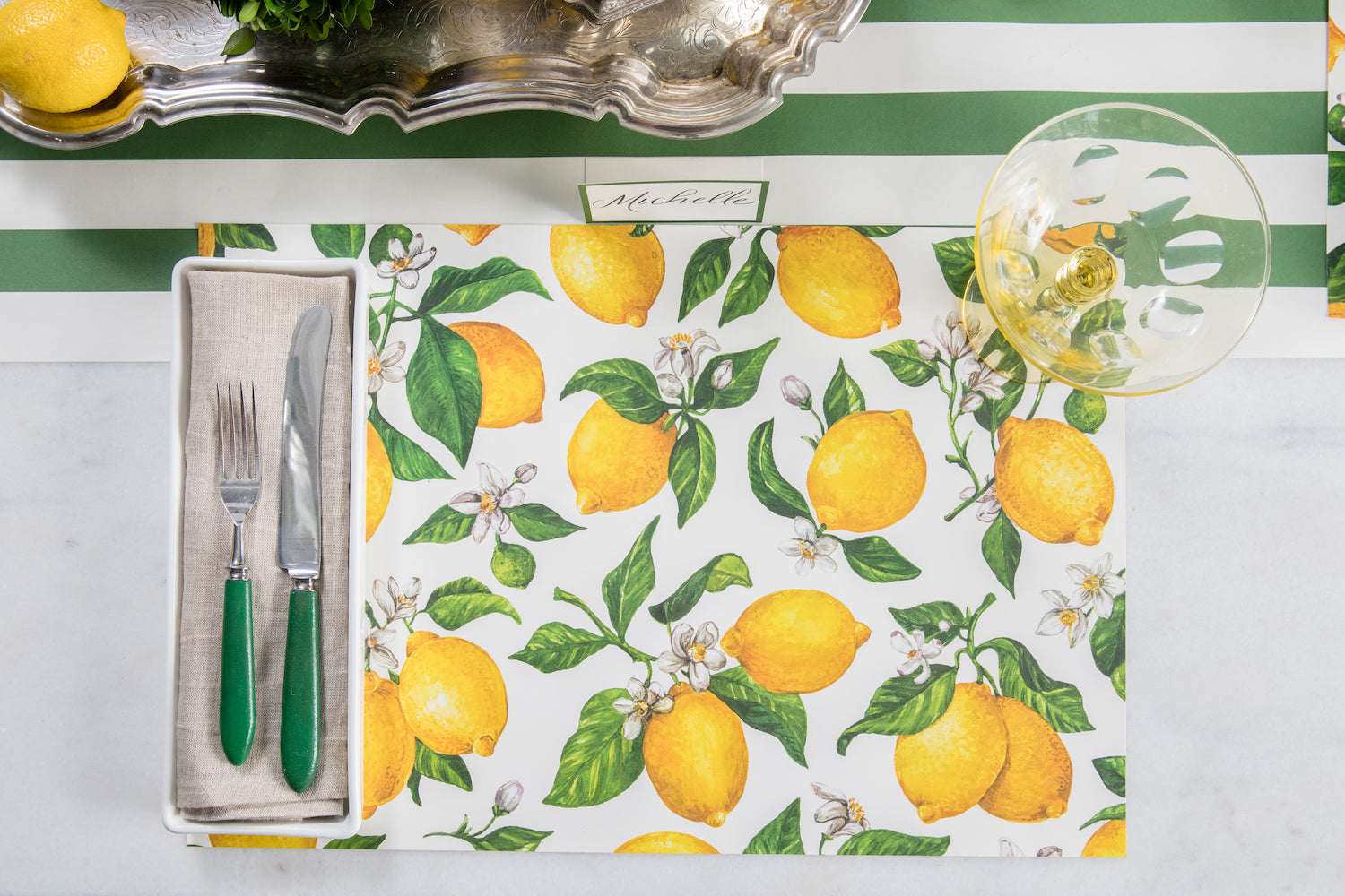 The Lemon Placemat in a bright summer-themed place setting, from above.