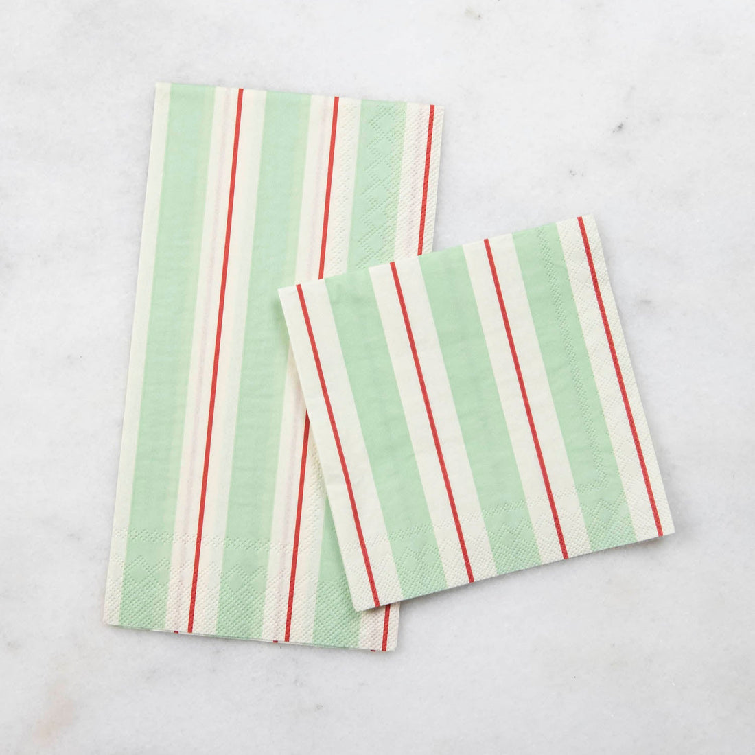 Two Seafoam &amp; Red Awning Stripe Napkins, one Guest and one Cocktail, by Hester &amp; Cook on a table.