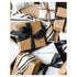 A close-up photo of a pile of simple wrapped gift boxes with ribbon in white, black and tan kraft paper, with "{you are a gift}" printed over a white gift.