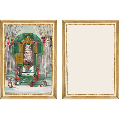 The illustrated front and blank back of a Flat Note, both sides framed in gold, featuring a painterly illustration of the open back of a vintage green carriage wagon with a decorated Christmas tree inside.