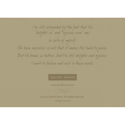 The beige back side of the greeting card, featuring a quote from artist David Arms.