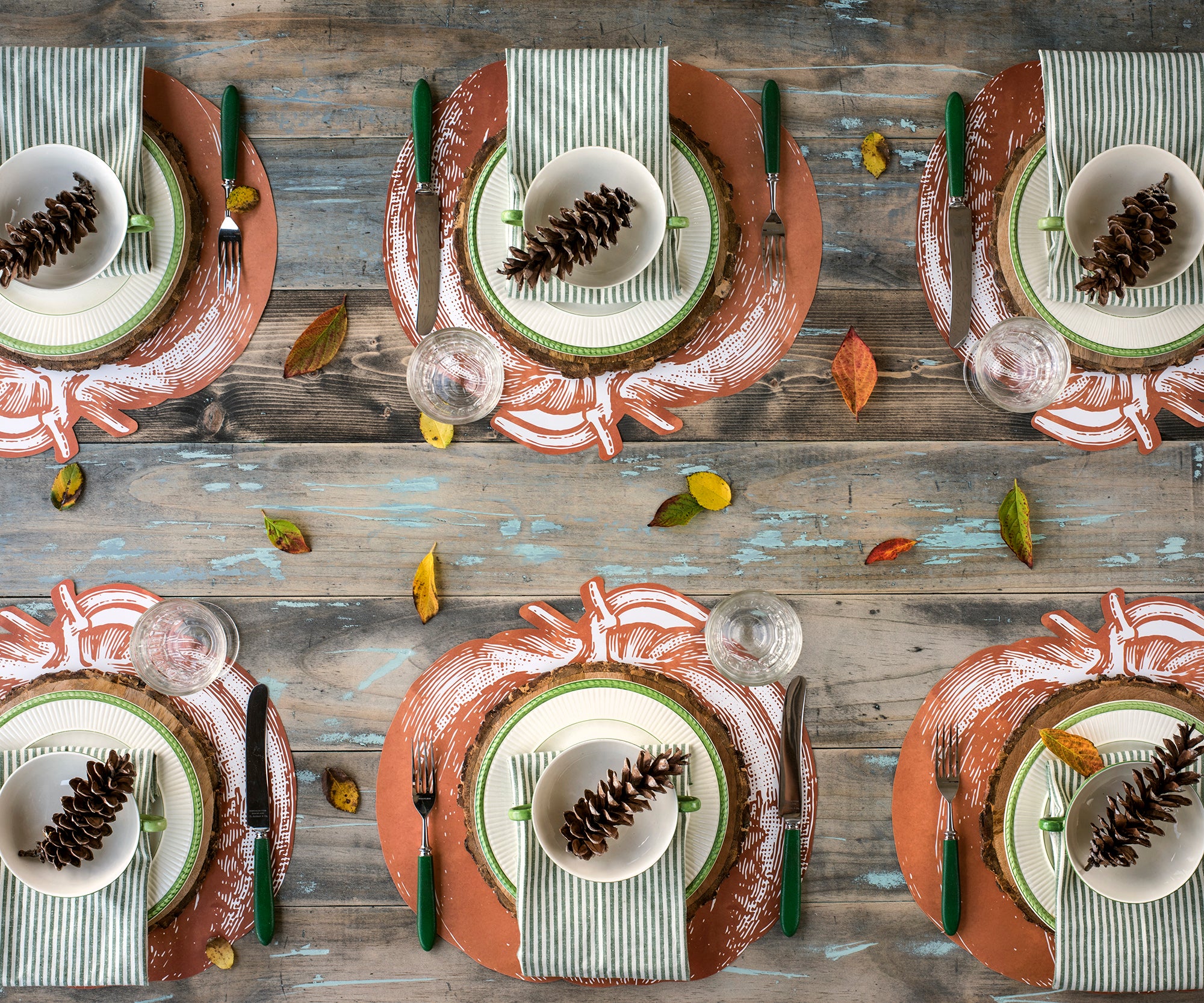 The Die-cut Pumpkin Placemat under an elegant fall-themed table setting for six, from above.