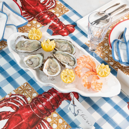 The Blue Painted Check Runner under a nautical-themed table setting with seafood.