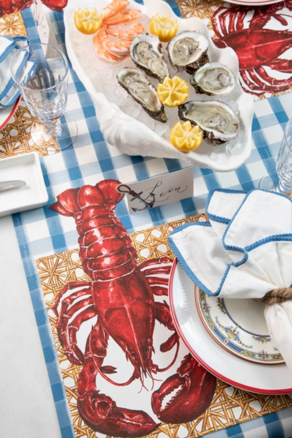 The Blue Painted Check Runner under a nautical-themed table setting with seafood.