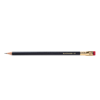 A stack of Blackwing Volume 20- Tribute to Tabletop Games pencils with gold lettering and distinctive square erasers on a black background.