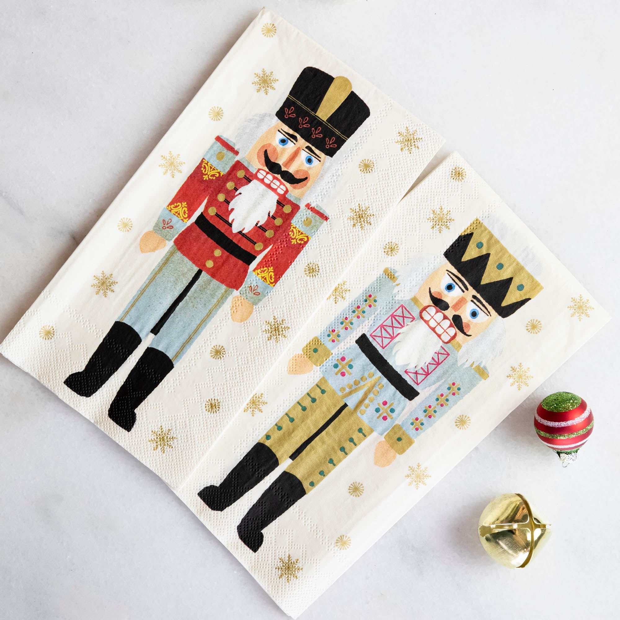 Two Nutcracker Guest Napkins, showing both the front and back soldier design.