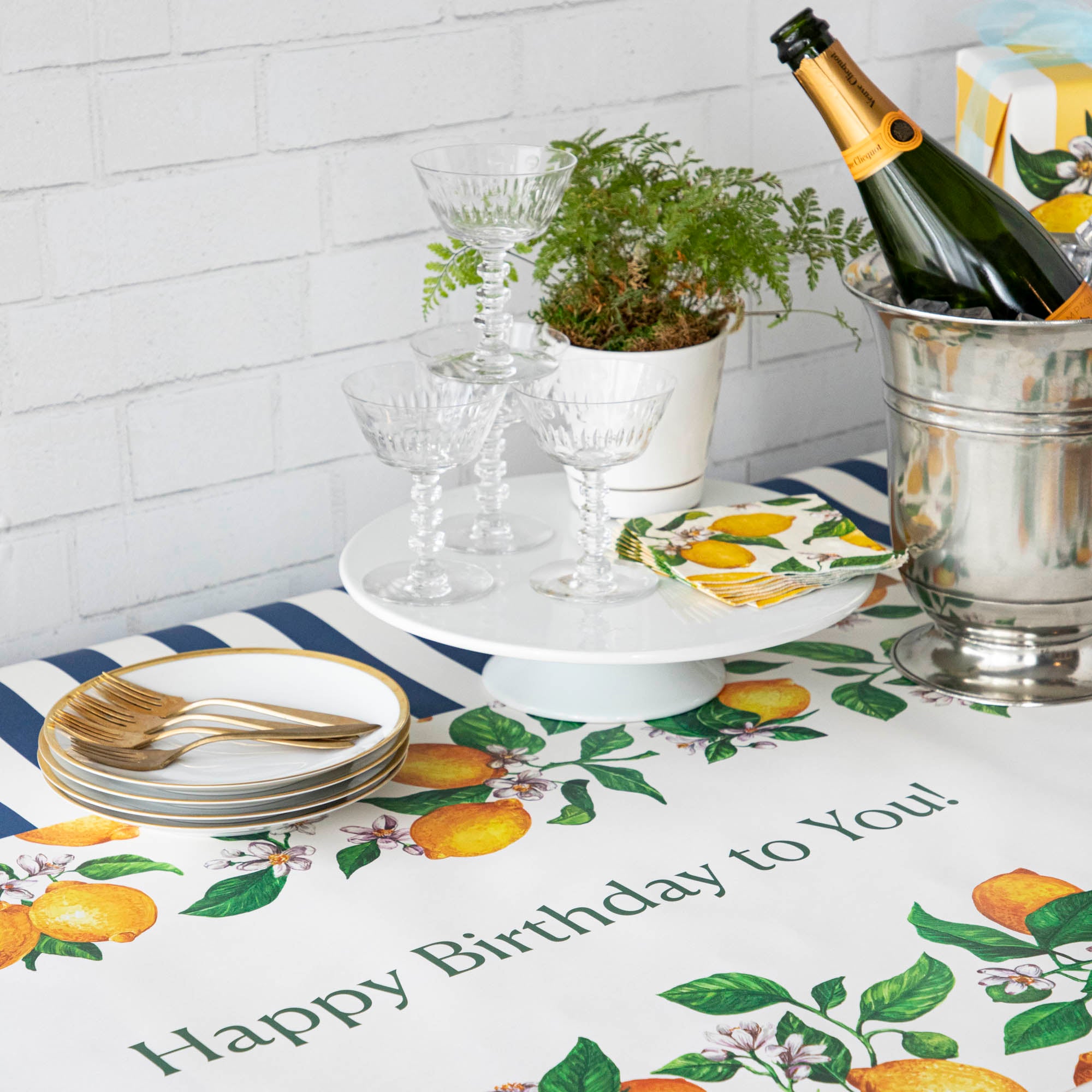 An elegant birthday table with the Lemons Personalized Runner, &quot;Happy Birthday to You!&quot; printed in green down the middle.