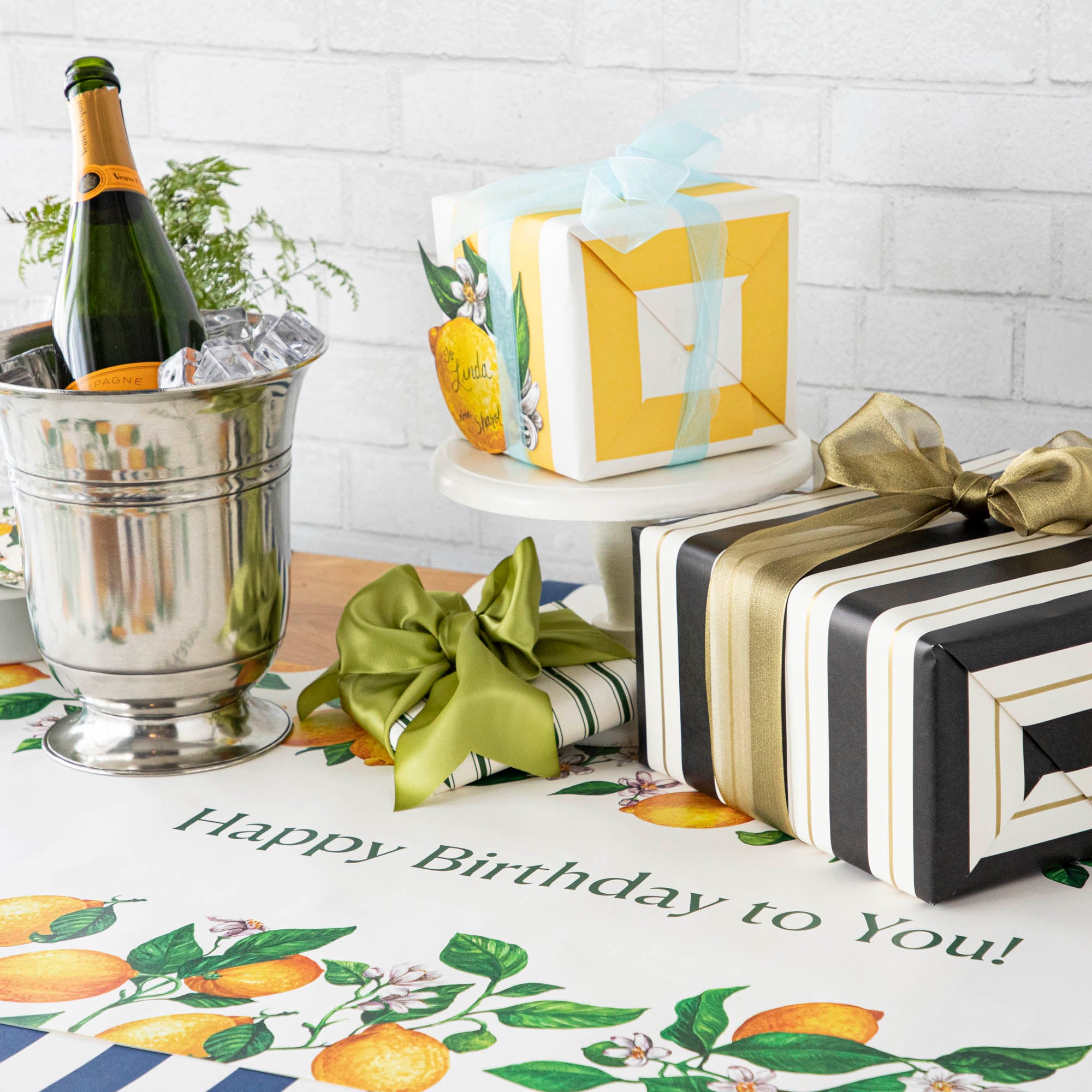 An elegant birthday table with the Lemons Personalized Runner, &quot;Happy Birthday to You!&quot; printed in green down the middle.