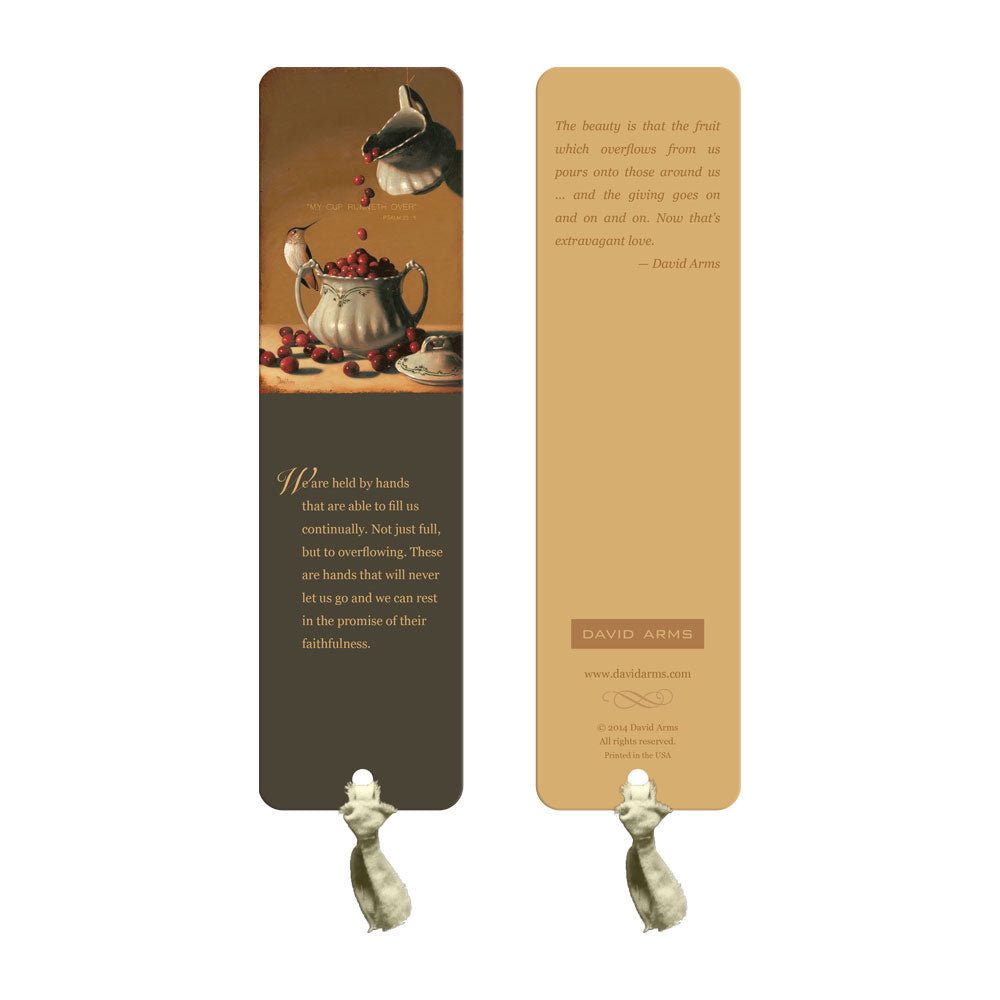 A David Arms bookmark with a hummingbird and a red ribbon.